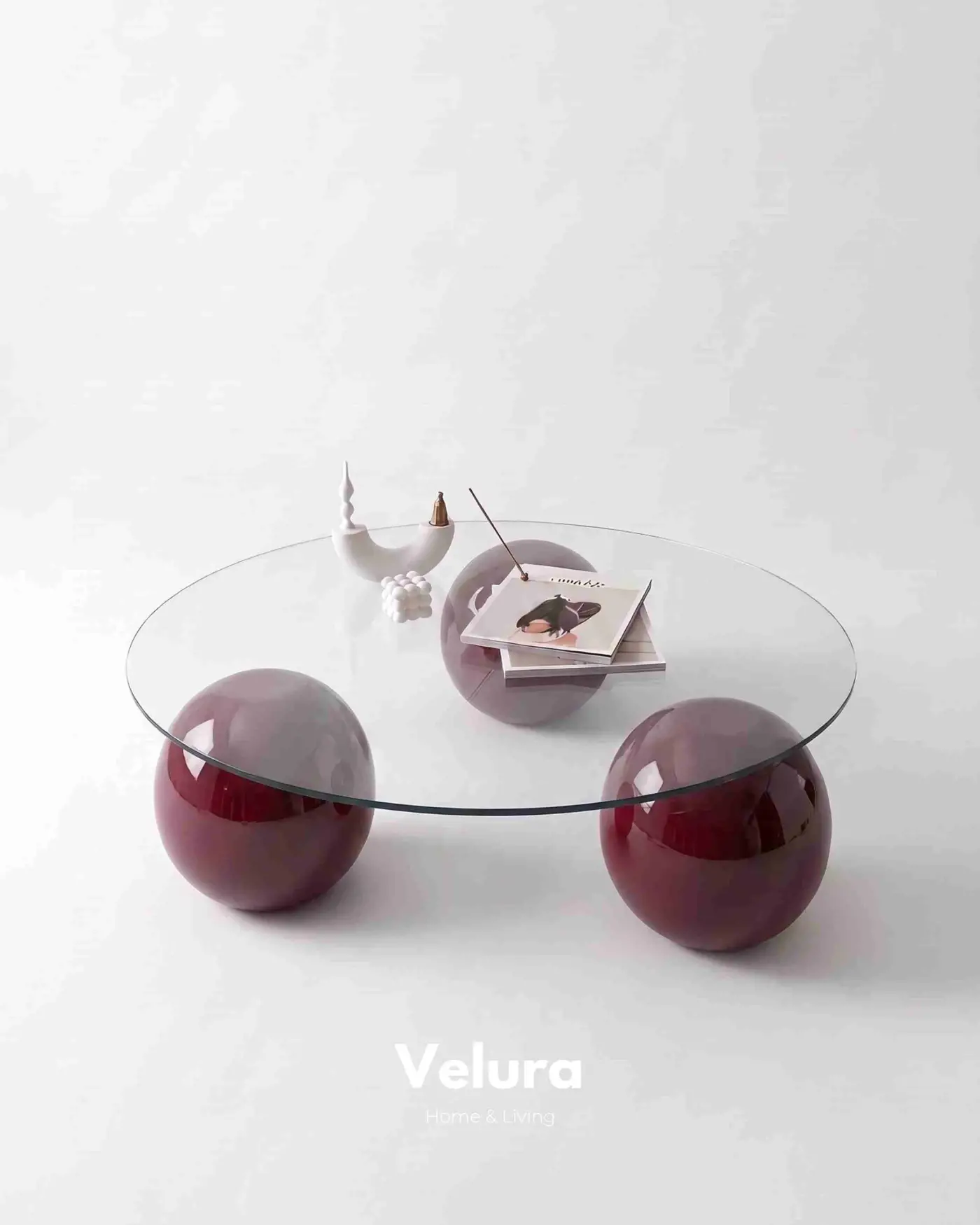 Şeffaf yuvarlak cam yüzeyli modern bordo sehpa